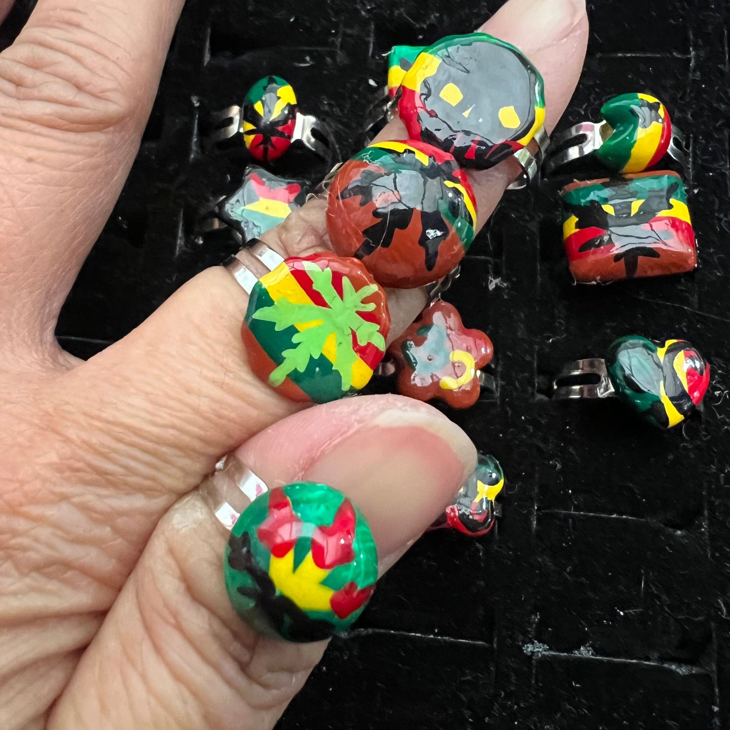 Pack of 12 pieces of Rings heart Star flower leaf weed skull Rasta painted Rings resizeable
