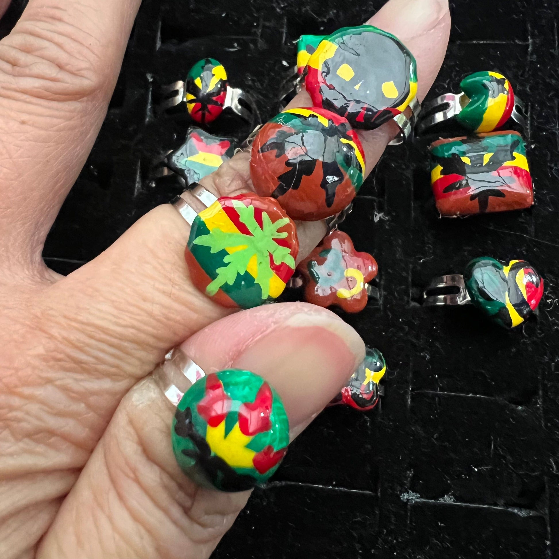 Pack of 12 pieces of Rings heart Star flower leaf weed skull Rasta painted Rings resizeable