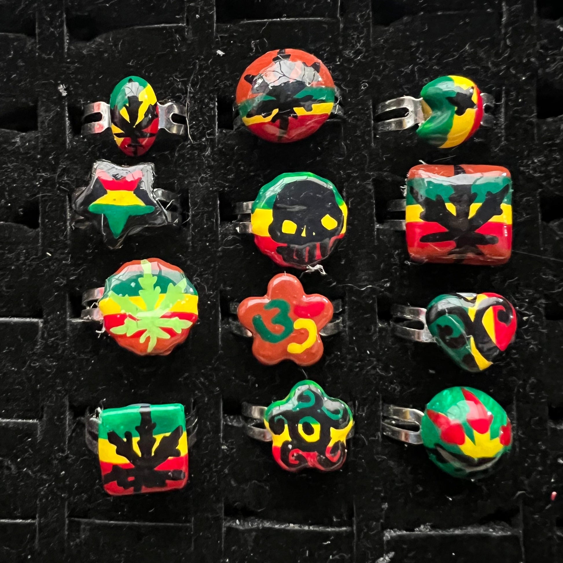 Pack of 12 pieces of Rings heart Star flower leaf weed skull Rasta painted Rings resizeable