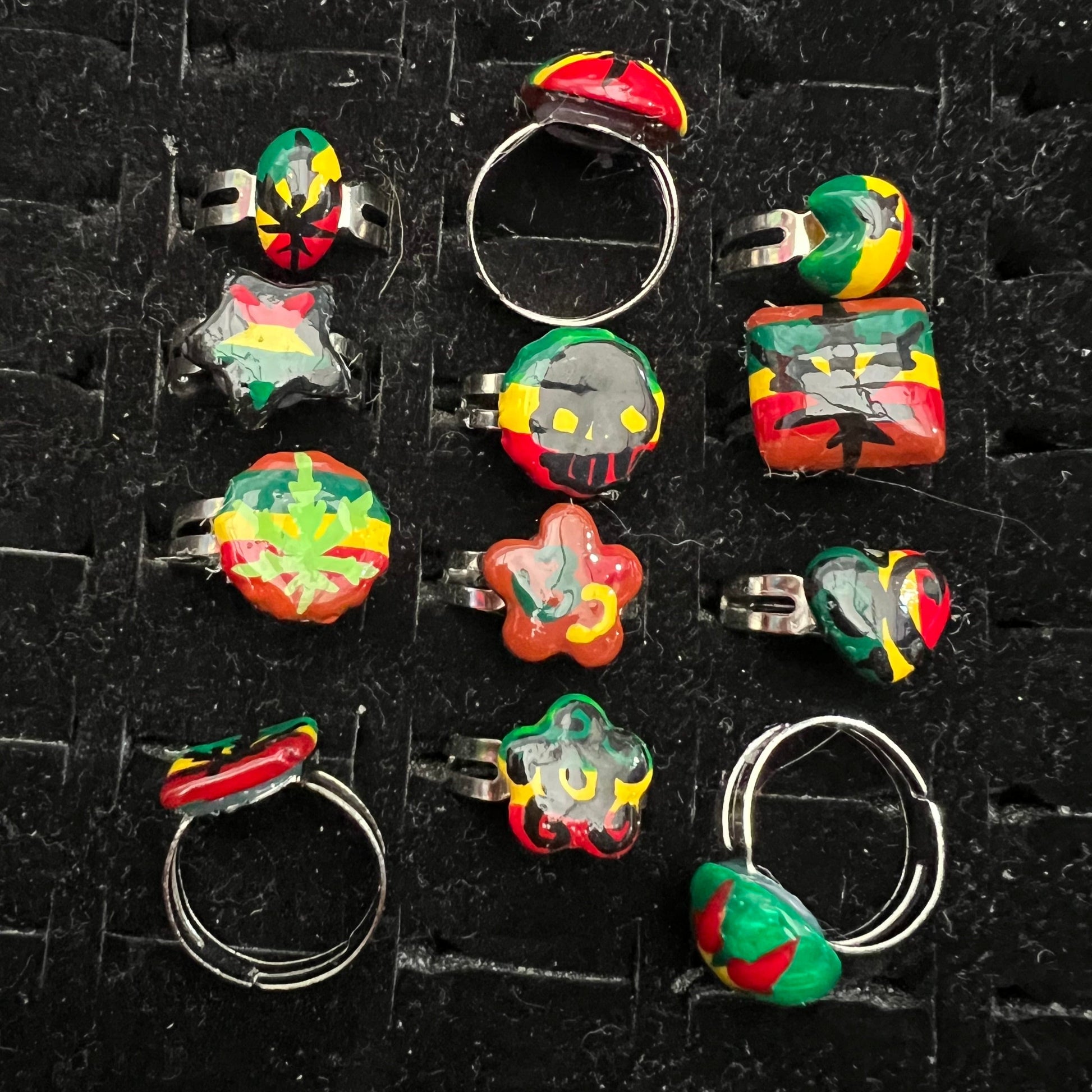 Pack of 12 pieces of Rings heart Star flower leaf weed skull Rasta painted Rings resizeable