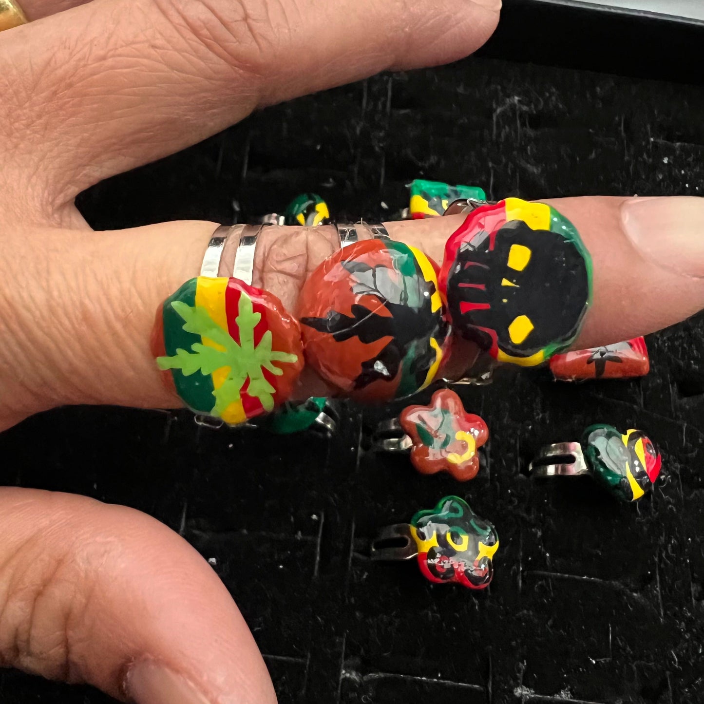 Pack of 12 pieces of Rings heart Star flower leaf weed skull Rasta painted Rings resizeable