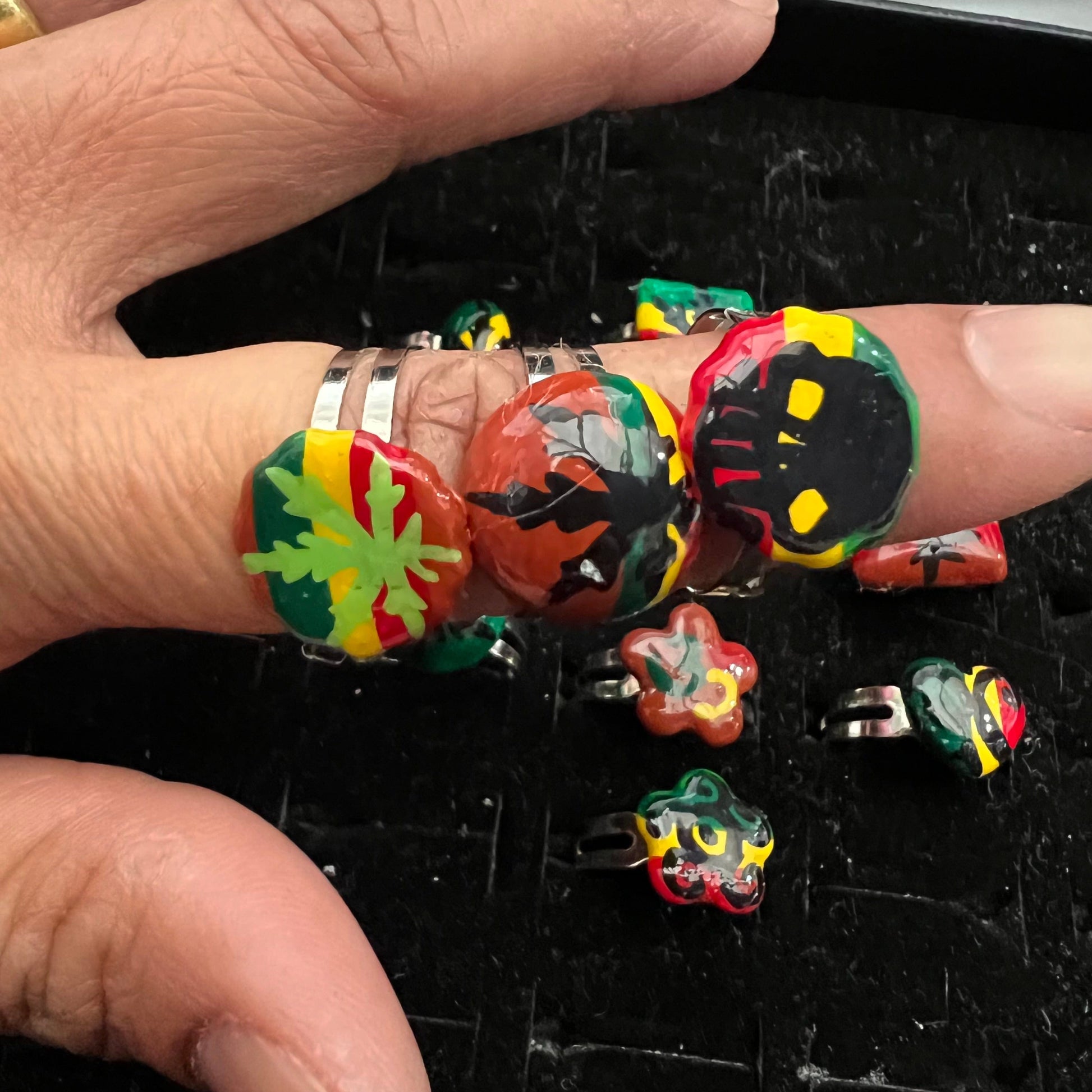 Pack of 12 pieces of Rings heart Star flower leaf weed skull Rasta painted Rings resizeable